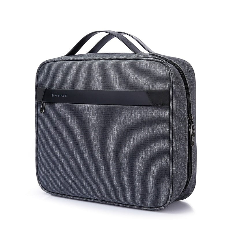 Trousse de toilette grise avec plusieurs compartiments pratiques