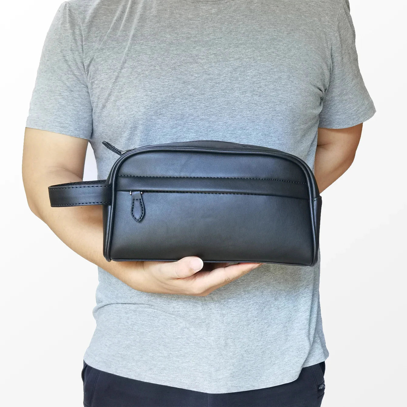 Trousse noire avec fermeture éclair et poignée de transport