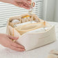 Trousse beige avec grande ouverture, détails des coutures