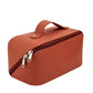 Trousse orange avec initiales dorées, style moderne