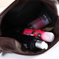 Vue de côté de la trousse de toilette avec poignée de transport