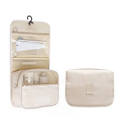 Trousse de toilette beige, compartiments visibles