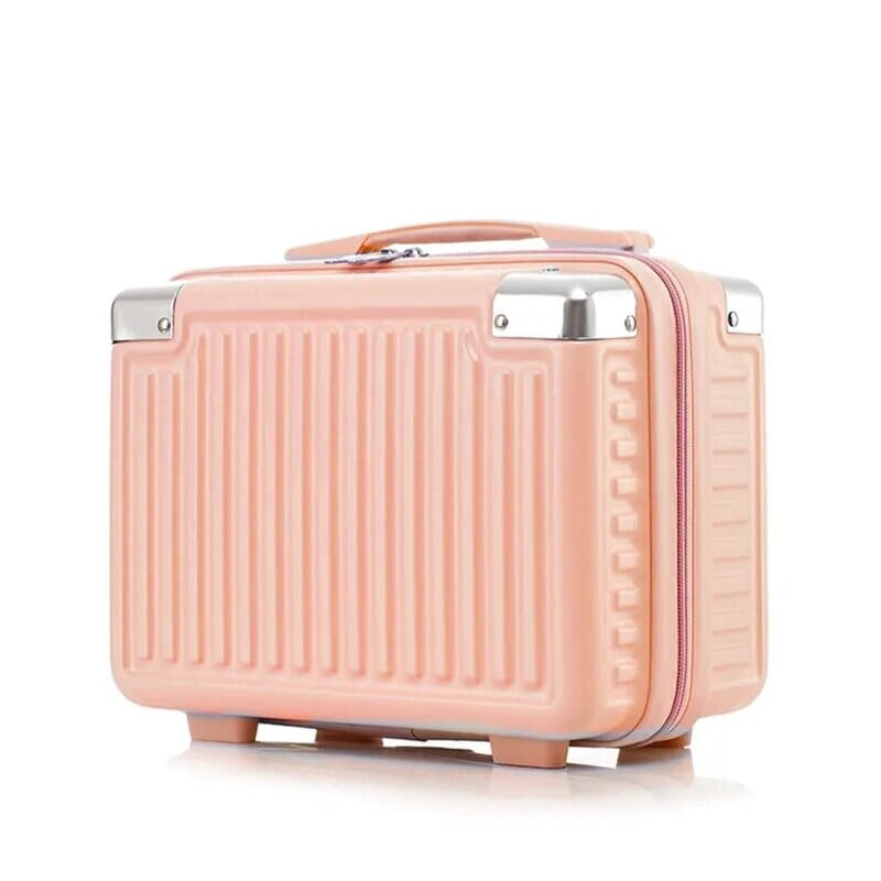 Vanity case rigide rose posé sur une surface plane